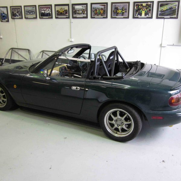 AGI - Mazda MX5 NA - CAMS Bolt-in Half cage with pastic rear window (side view in car)